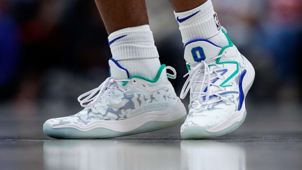 View of Tyrese Maxey's white New Balance shoes.